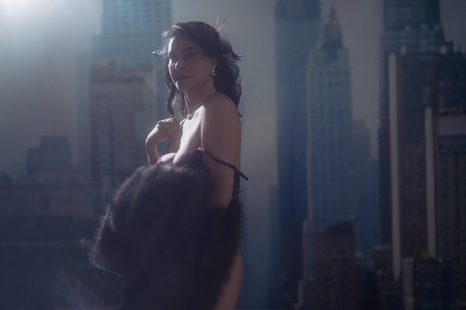 Luxury boudoir portrait — fur coat with city skyline, Mishawaka, Indiana